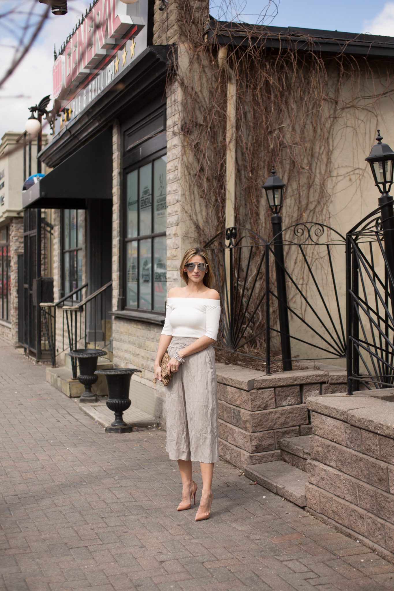 Lucky 7 Ribbed Off the Shoulder Top Jean Machine, Wilfred Nanterre pants from Aritzia, Nude Christian Louboutin pumps, Dior So Real Sunglasses, leaopard print clutch from Charming Charlie