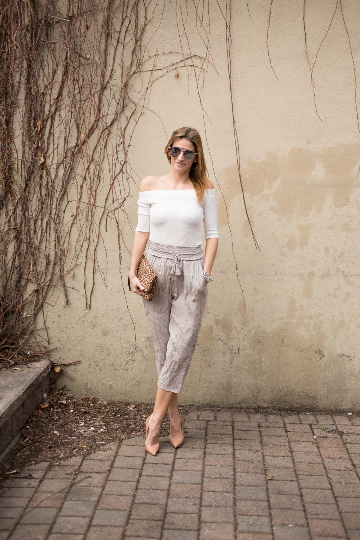 Lucky 7 Ribbed Off the Shoulder Top Jean Machine, Wilfred Nanterre pants from Aritzia, Nude Christian Louboutin pumps, Dior So Real Sunglasses, leopard print clutch from Charming Charlie
