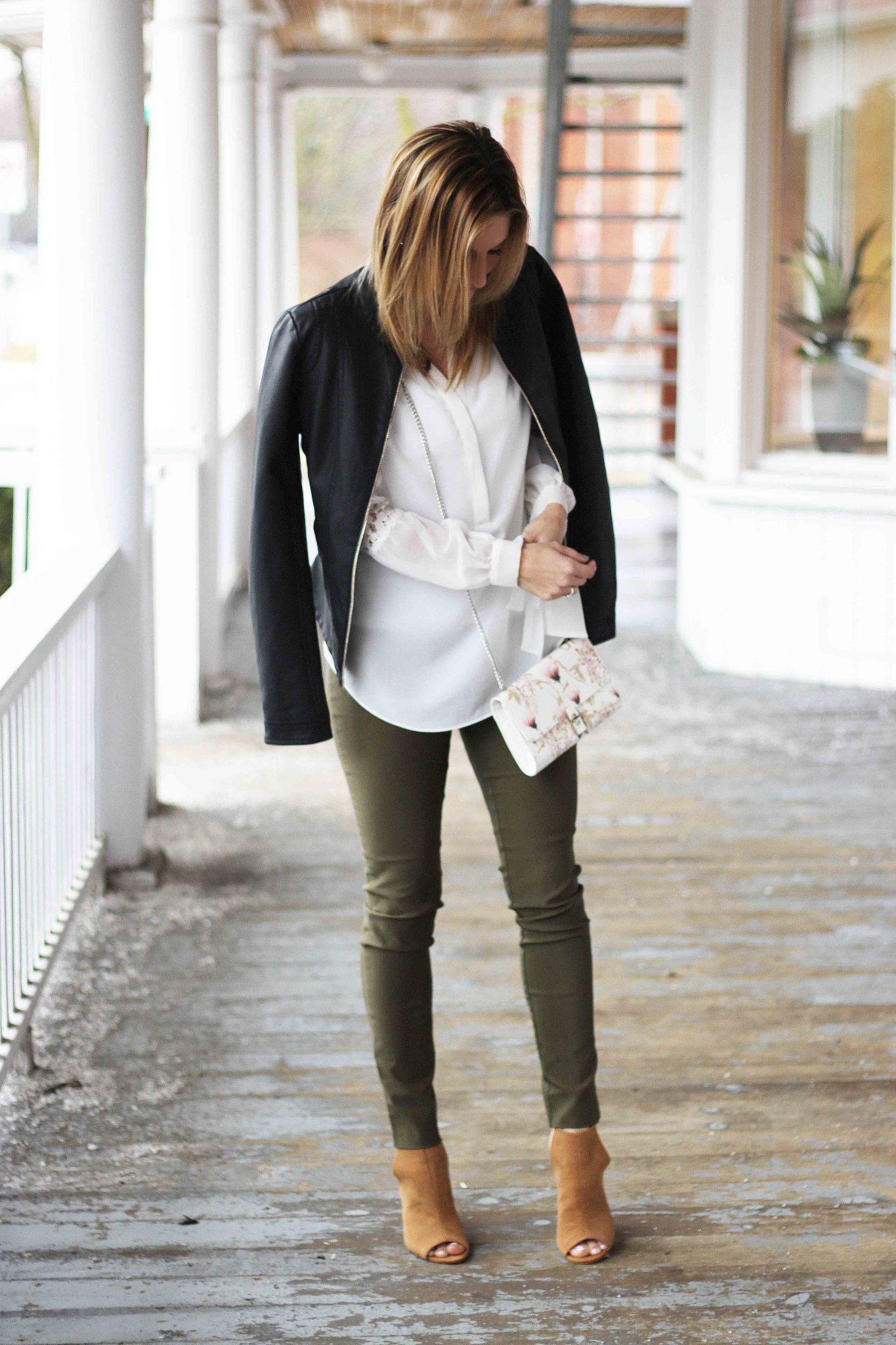 Spring Look From Le Chateau, White peasant blouse, olive green pants, black leather jacket, floral cross body bag, Suede peep toe shootie