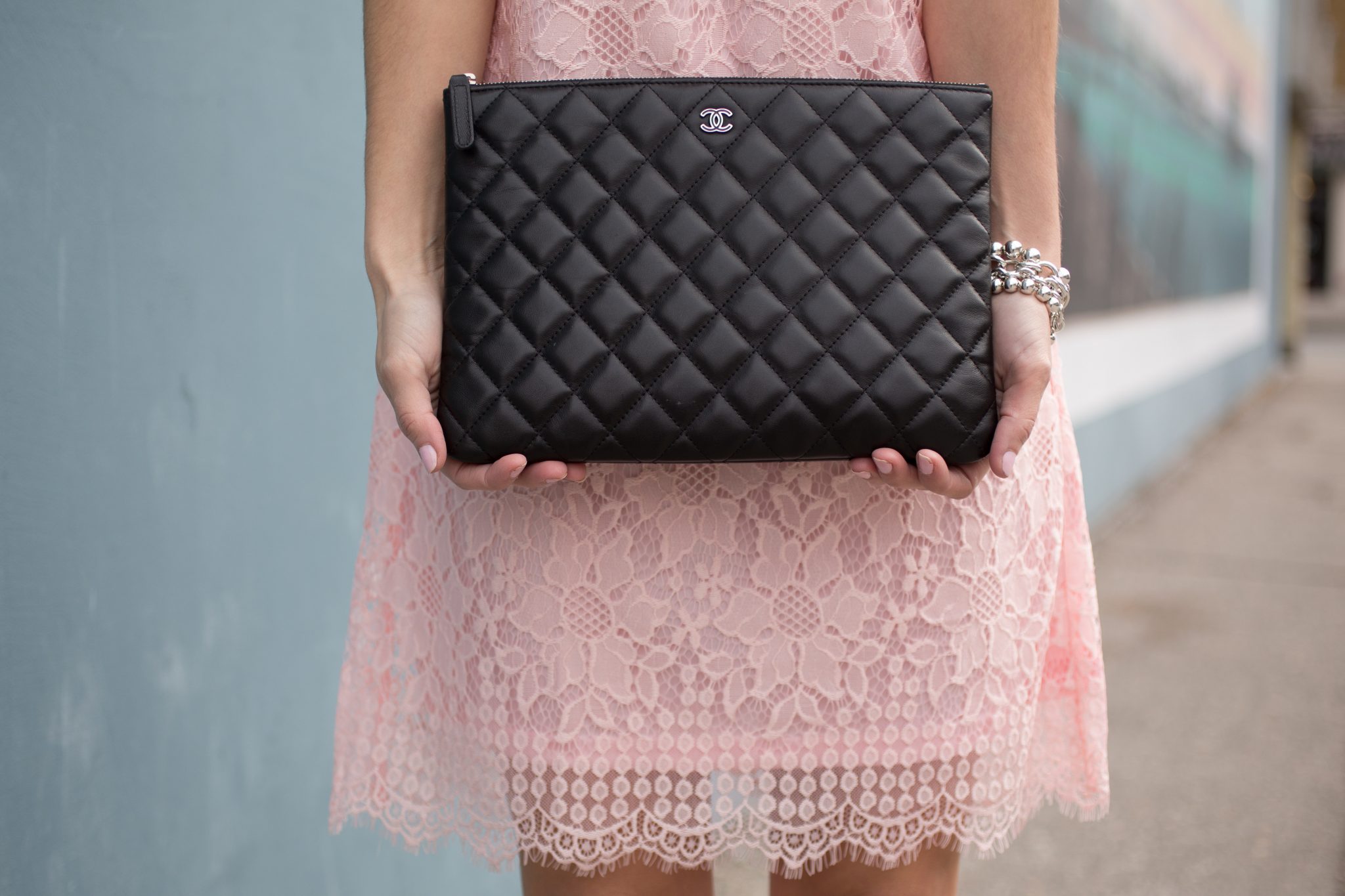 Pink lace off the shoulder dress from Suzy Shier, Chanel black quilted clutch, black suede lace up pumps, Ray-Ban Aviators