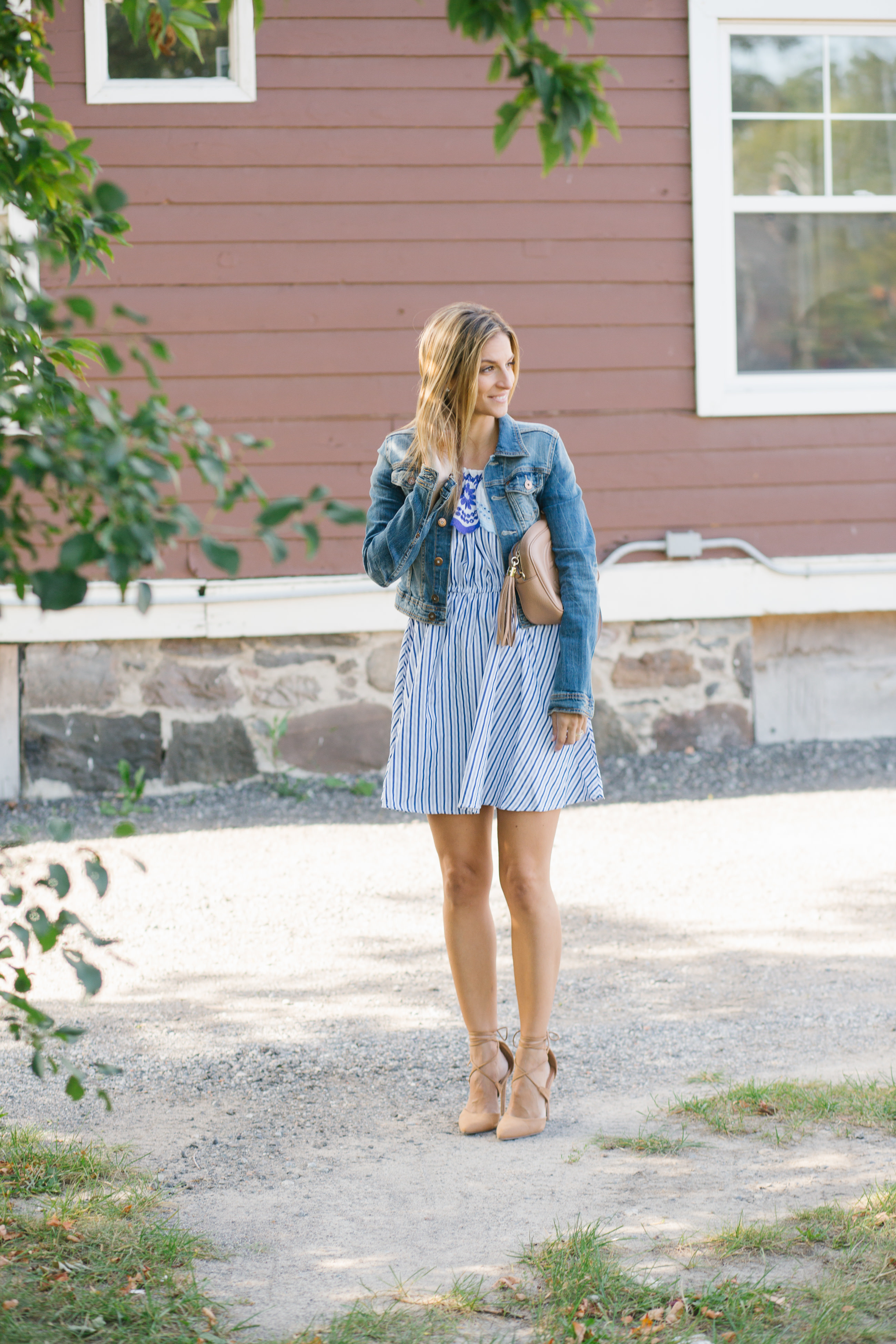 styling a jean jacket with a summer dress