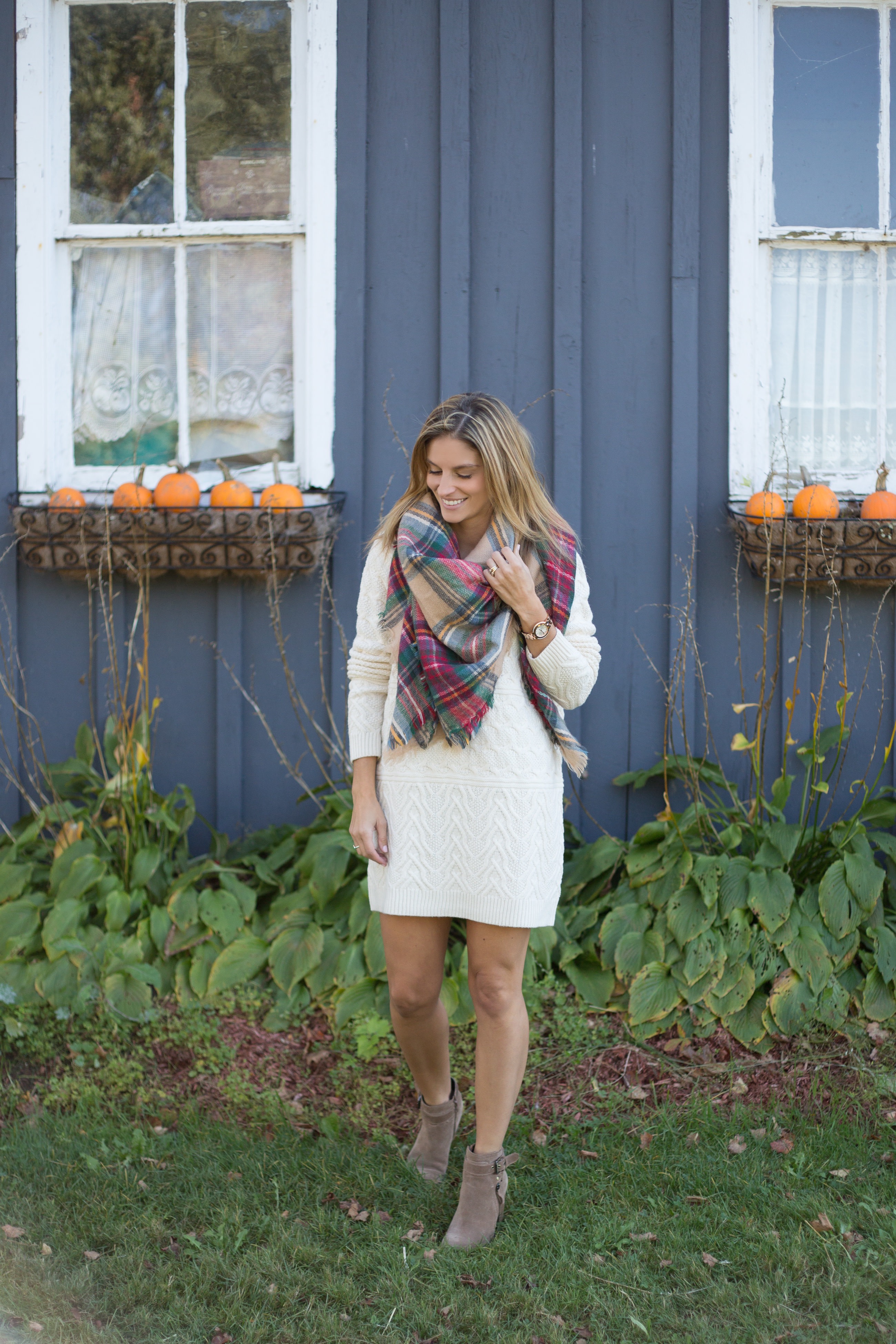 Fall style with a white cable knit sweater dress and plaid blanket scarf Mandy Furnis