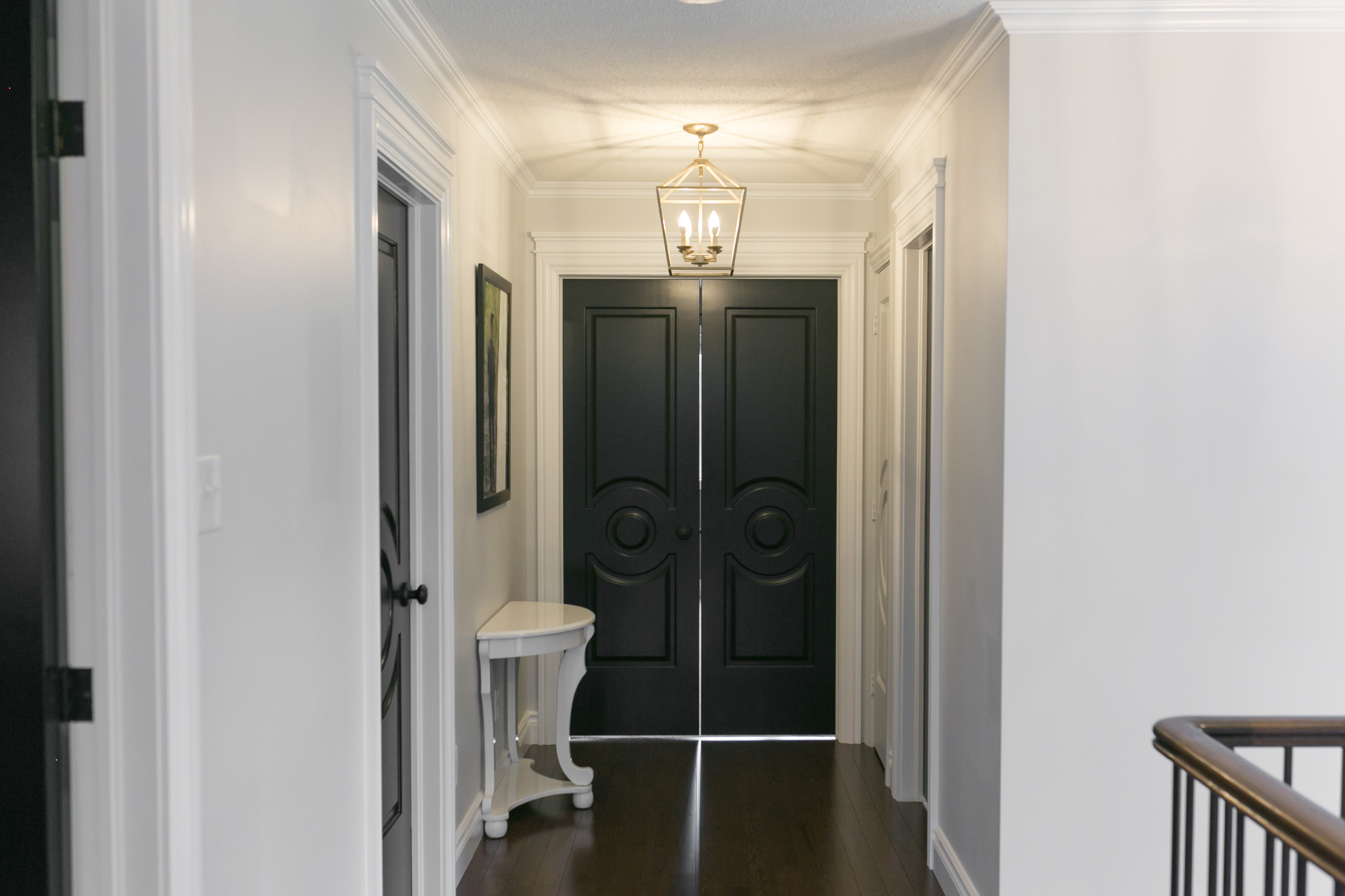 white hallway with black doors metrie sparkleshinylove