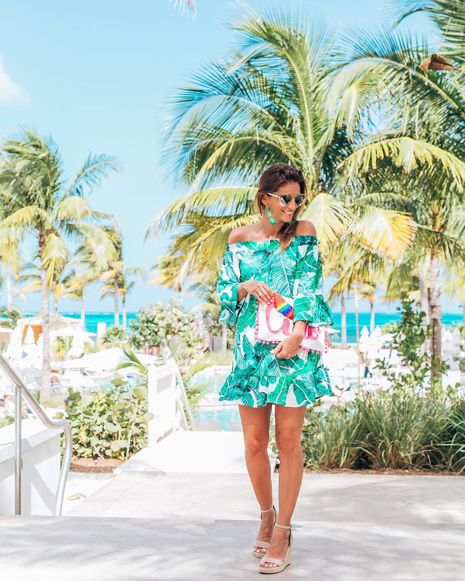 Palm print summer dress, ciao tassel and pom pom clutch, nude espadrilles, green drop earrings, dior so real sunglasses, mandy furnis sparkleshinylove, baha mar resort style