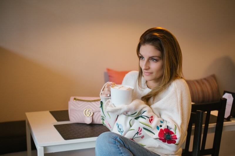 Guess Floral embroidered sweater, guess Low-rise skinny jeans, pink bow slides, pink Gucci Marmount bag sparkleshinylove spring style, M&R Cakes and Cafe