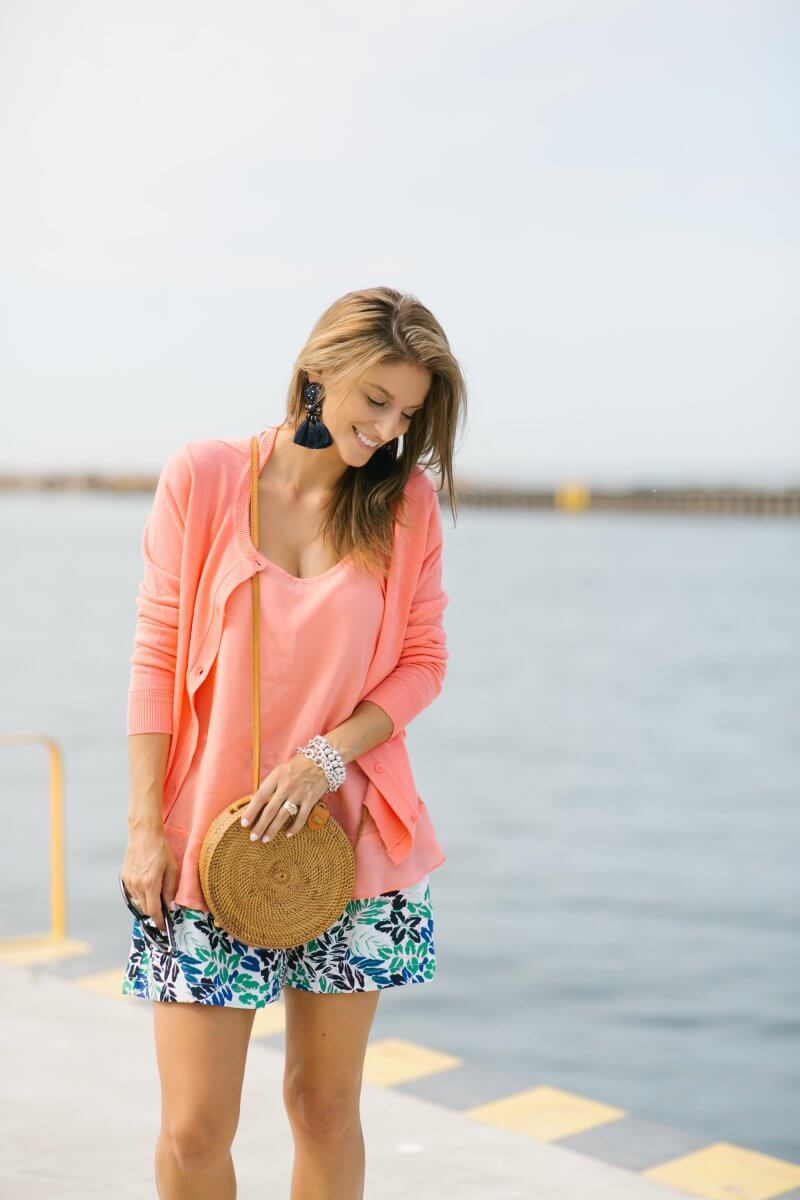Easy summer look with patterned shorts, coral cami, and coral cardigan with tassel earrings and straw bag; sparkleshinylove colourful summer look