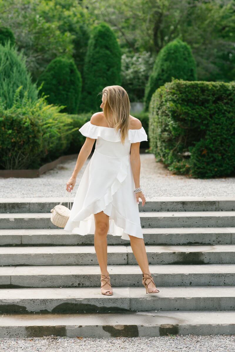 White off the shoulder ruffled dress, wicker basket bag; style for a wedding; pretty white dress; whitby blogger