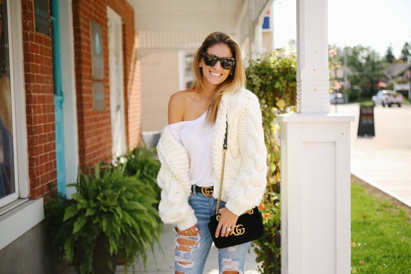 White chunky knit sweater, ripped jeans, black velvet gucci bag, gucci belt; fall outfit with a chunky knit; how to style a chunky knit sweater; whitby blogger sparkleshinylove