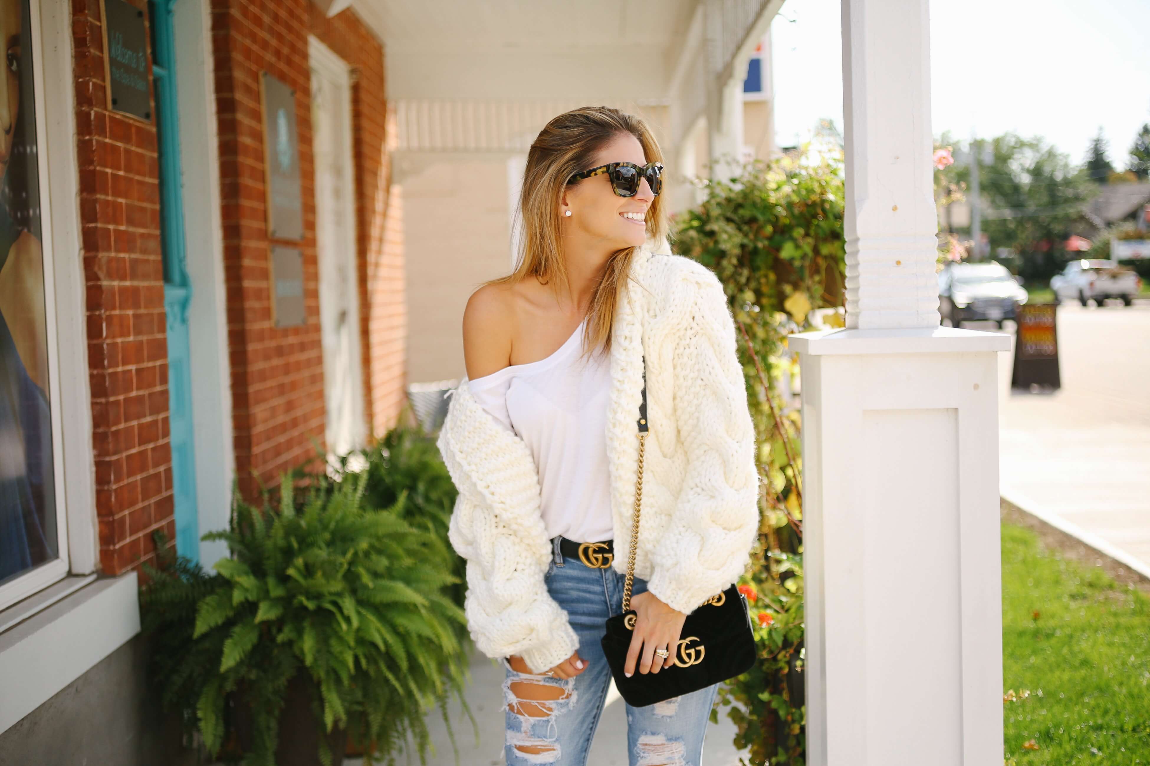 White chunky knit sweater, ripped jeans, black velvet gucci bag, gucci belt; fall outfit with a chunky knit; how to style a chunky knit sweater; whitby blogger sparkleshinylove