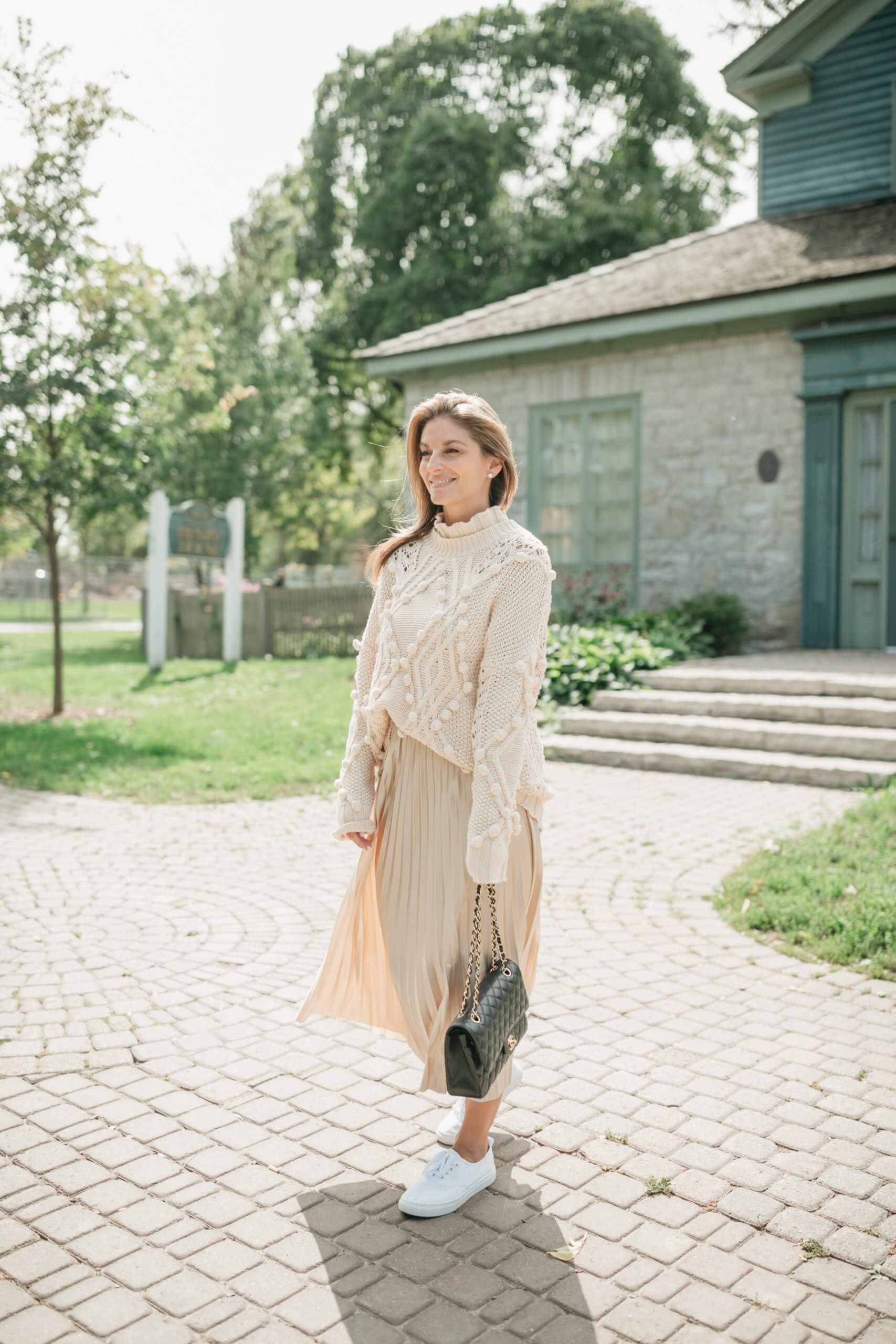 Chicwish HOLLOW OUT POM-POM CABLE KNIT SWEATER IN CREAM; chicwish FULL PLEATED MIDI SKIRT IN CHAMPAGNE; Fall look with maxi skirt; chanel flap bag; sparkleshinylove  