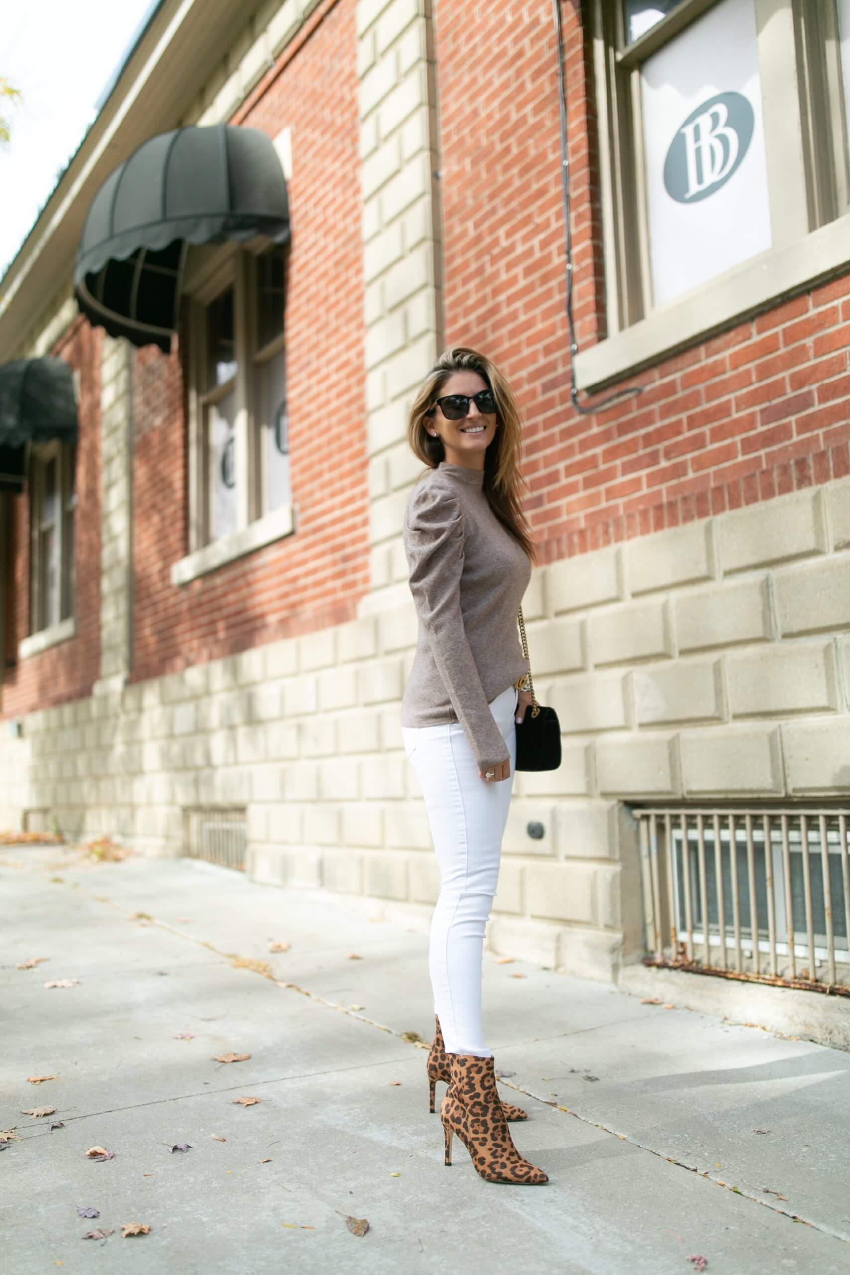 Winter white jeans; winter look with white jeans; detailed ruffle shoulder top; gucci belt; leopard boots; mandy furnis durham region blogger